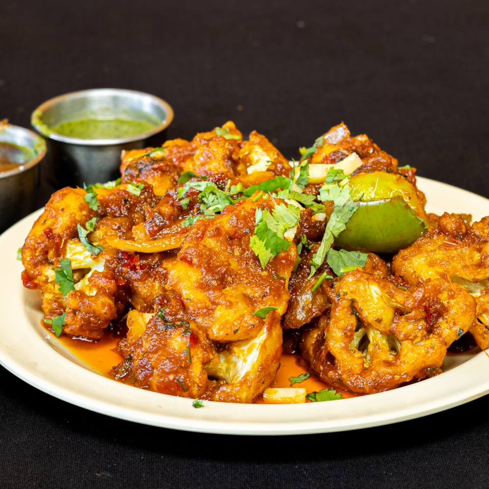 Spiced bites with lime and chutneys at Curry Corner